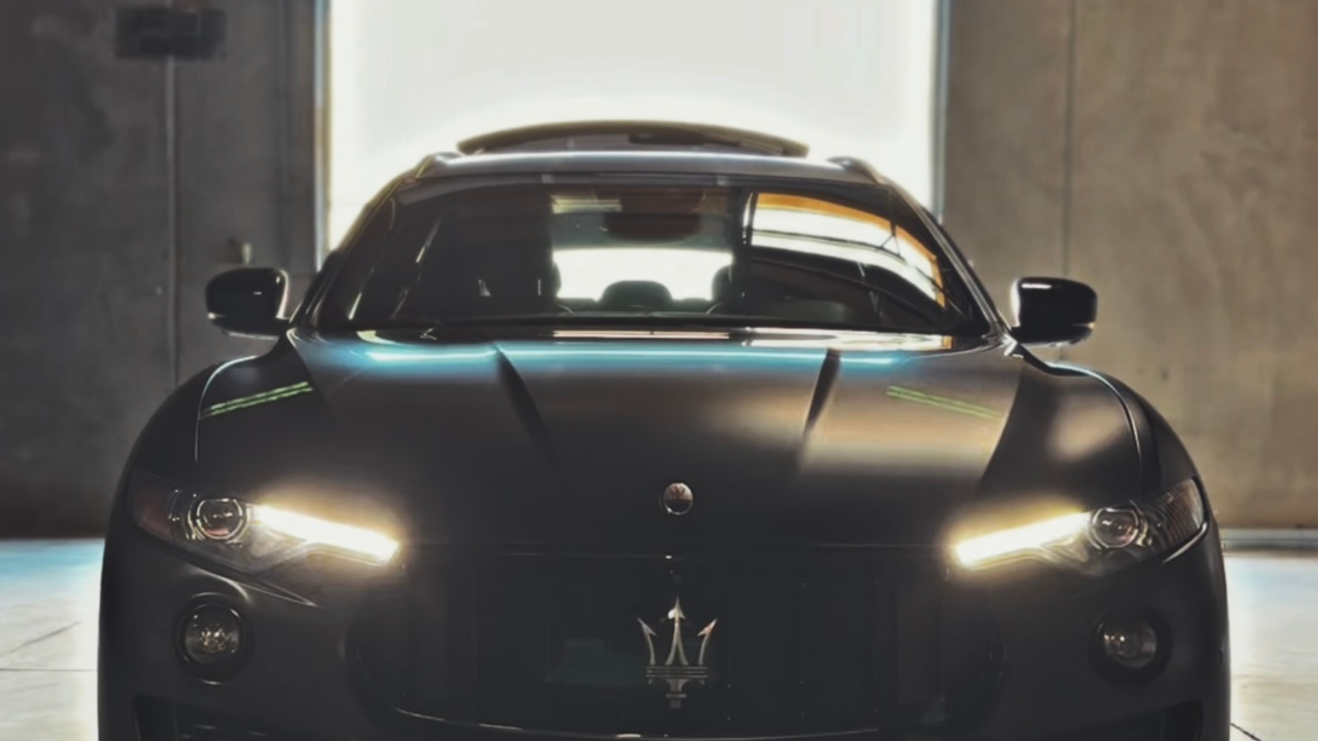 Auto Services – Tint, PPF, Ceramic Coating & Auto Glass | Clear Cut Glass and Tint Luxury Maserati SUV with matte protection film inside shop, representing auto tint, PPF, ceramic coating, and auto glass services by Clear Cut Glass and Tint in Glendale AZ.