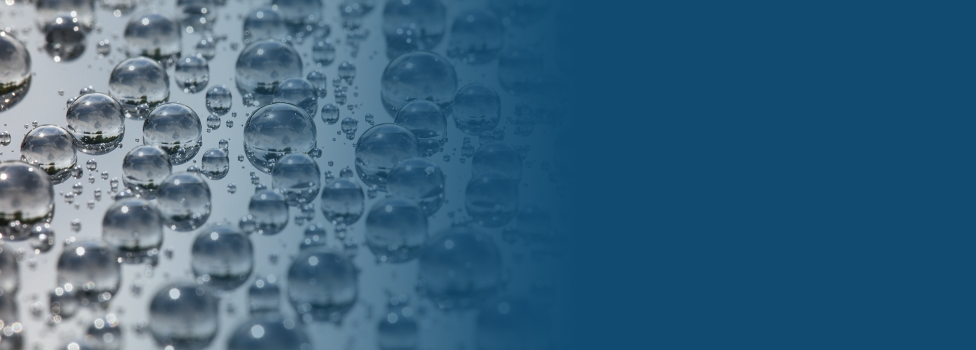 Close-up of water beading on a ceramic-coated surface showing high hydrophobic protection at Clear Cut Glass in Glendale AZ