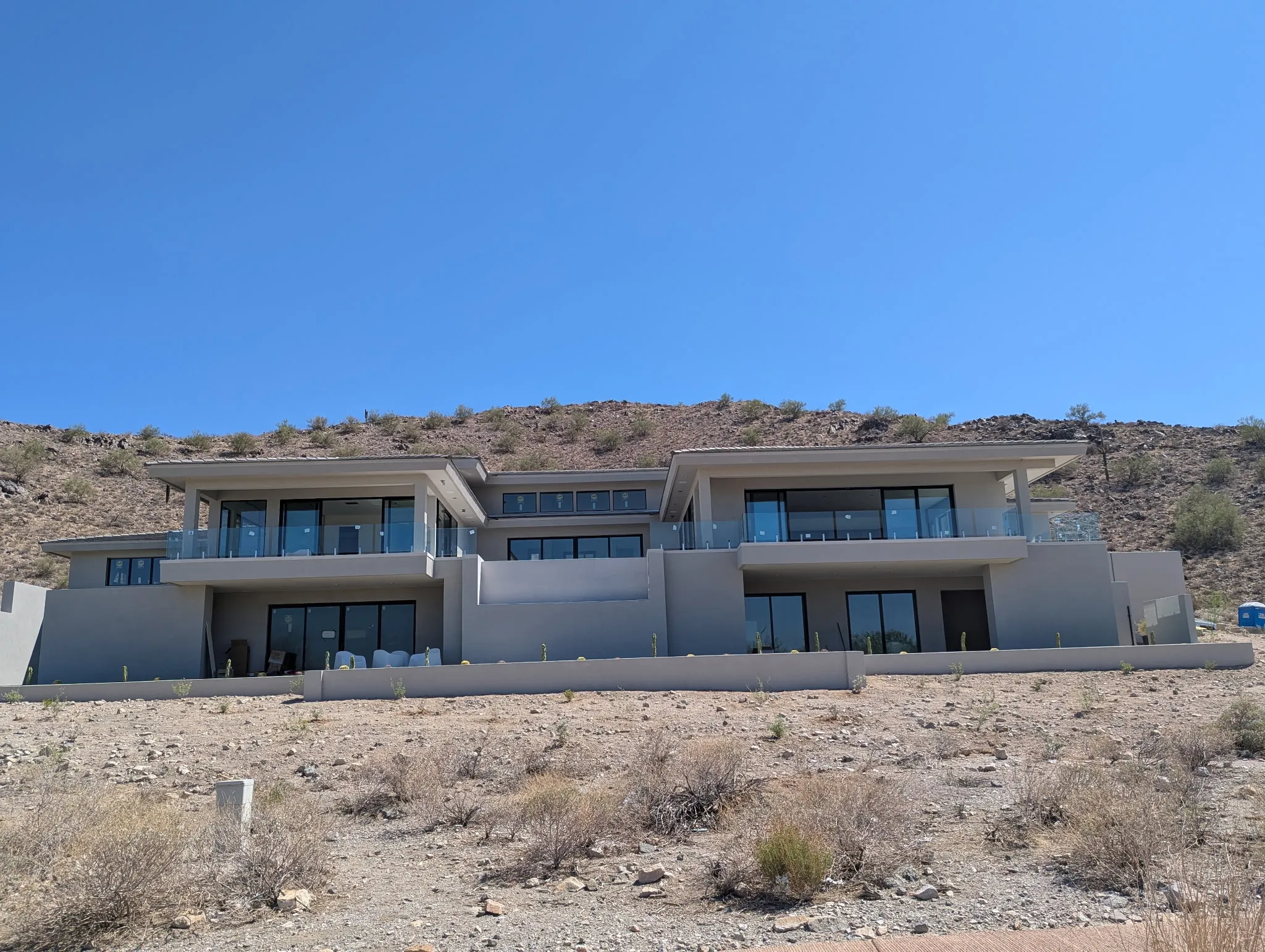 Luxury Modern Home with Custom Residential Glass | Clear Cut Glass and Tint Modern multi-level Arizona home featuring custom residential glass railings, large window systems, and exterior glass installed throughout by Clear Cut Glass and Tint