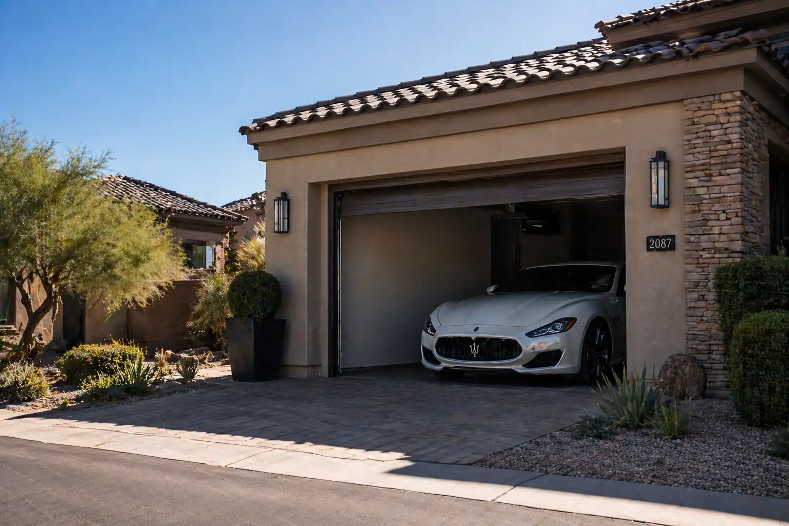 Luxury car parked inside a shaded residential garage in Arizona to reduce sun exposure and protect paint protection film