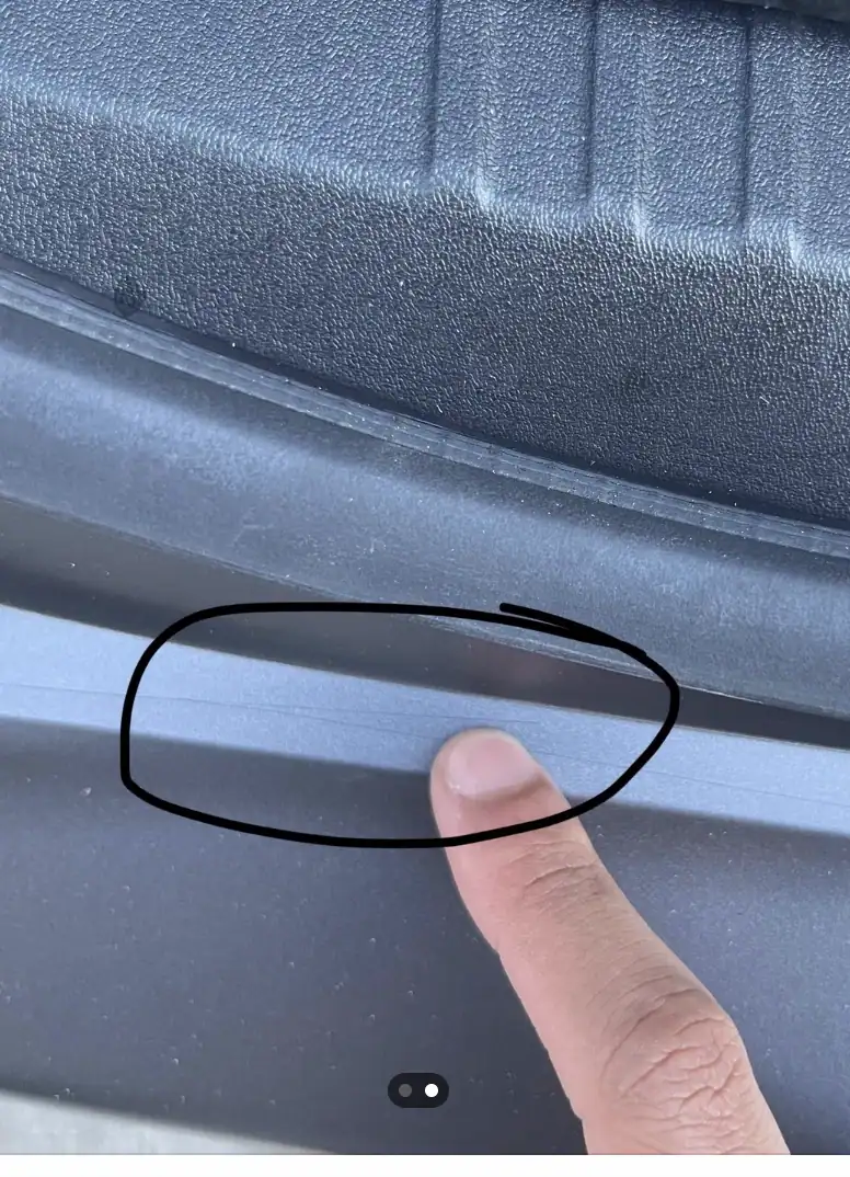 Cut marks in vehicle paint caused by improper paint protection film installation using a blade on the surface
