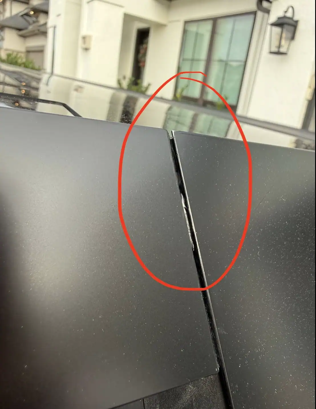 Paint protection film with exposed edge inside panel gap due to lack of proper edge wrapping during installation