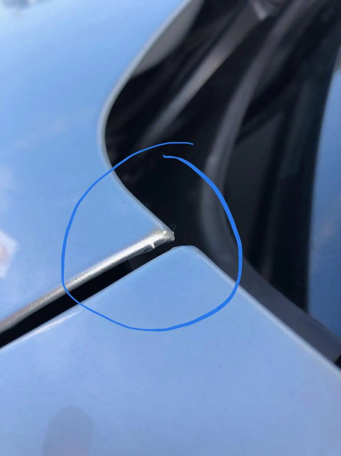 Matte paint protection film lifting at a sharp corner edge due to poor installation and lack of proper edge wrapping