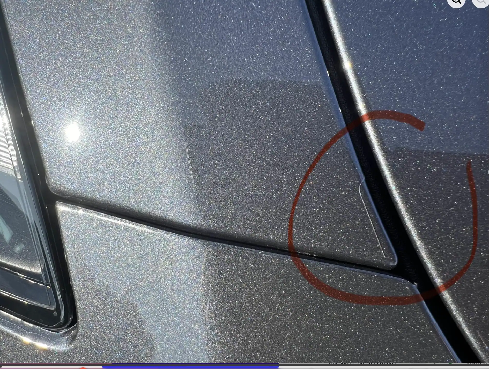 Misaligned paint protection film with uneven coverage gap along panel edge due to poor installation