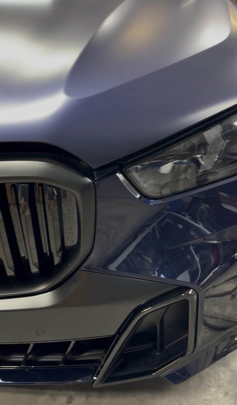 BMW showing side-by-side comparison of matte PPF and original gloss paint finish in Glendale Arizona