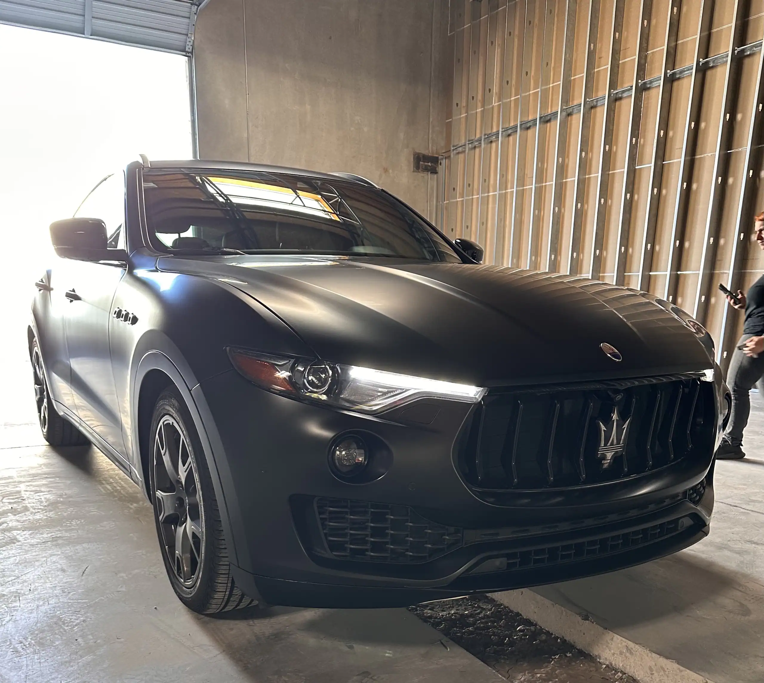 Maserati Levante SUV with satin matte paint protection film inside automotive shop in Glendale Arizona