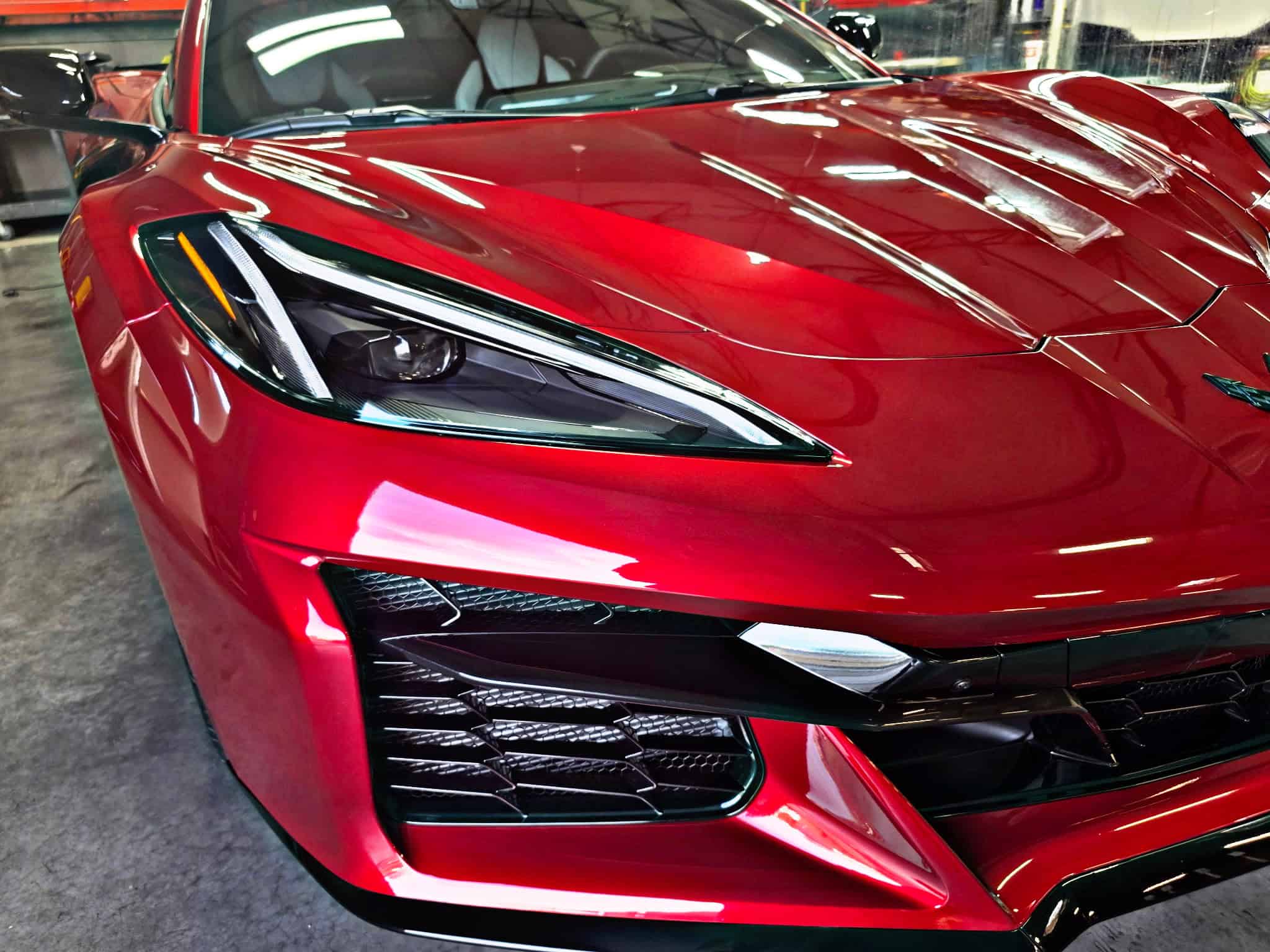 Red Chevrolet Corvette with clear gloss paint protection film inside Clear Cut Glass and Tint in Glendale Arizona
