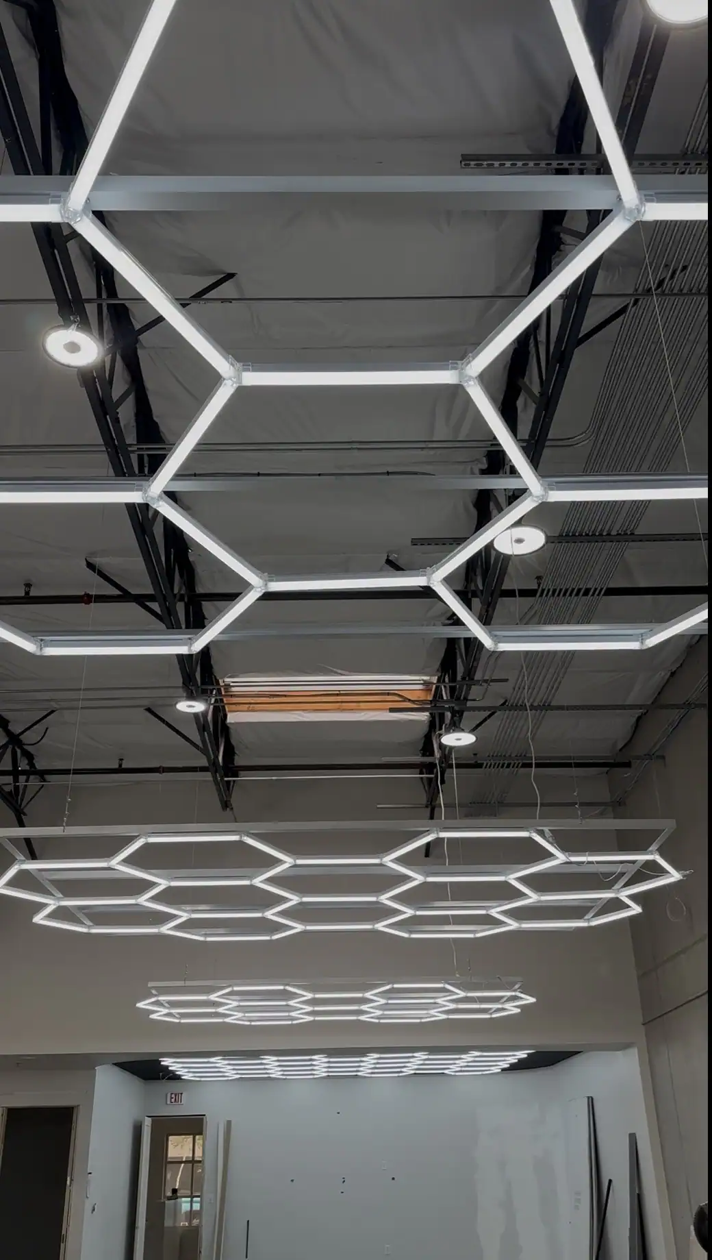 Professional Indoor Window Tint Installation Environment Climate-controlled window tint installation bay with professional LED lighting designed for precision automotive film installation.