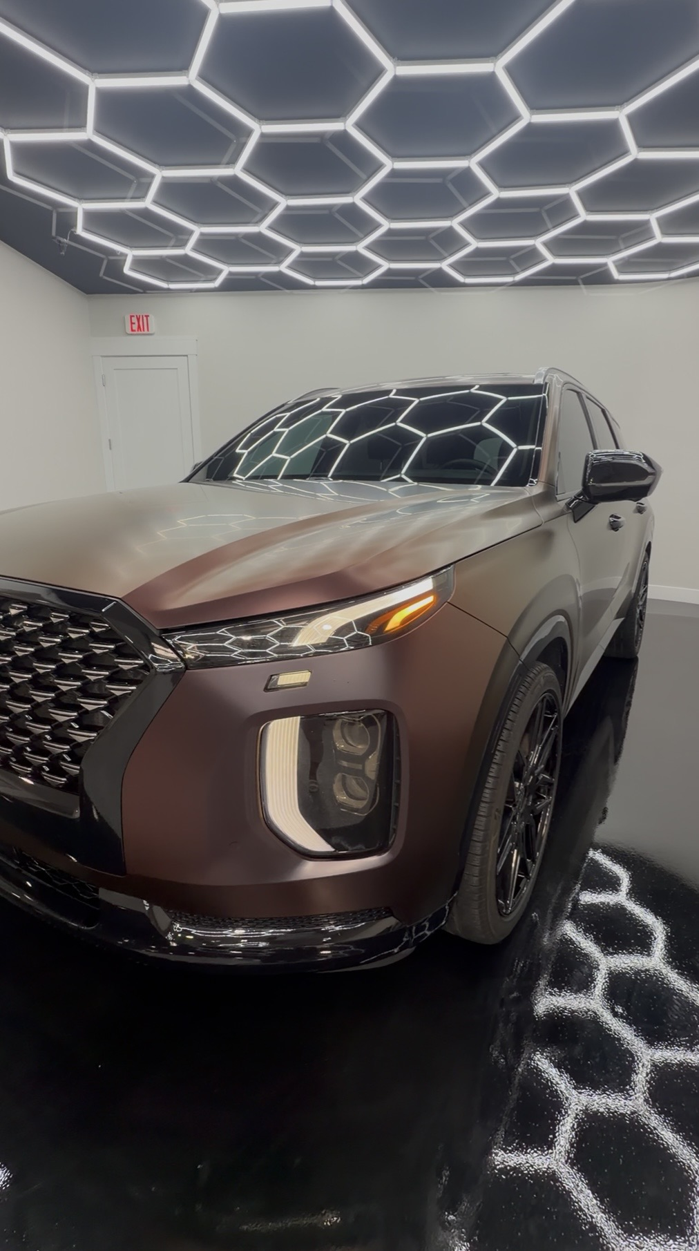 A Hyundai Palisade finished in satin color change paint protection film installed by Clear Cut Glass & Tint.