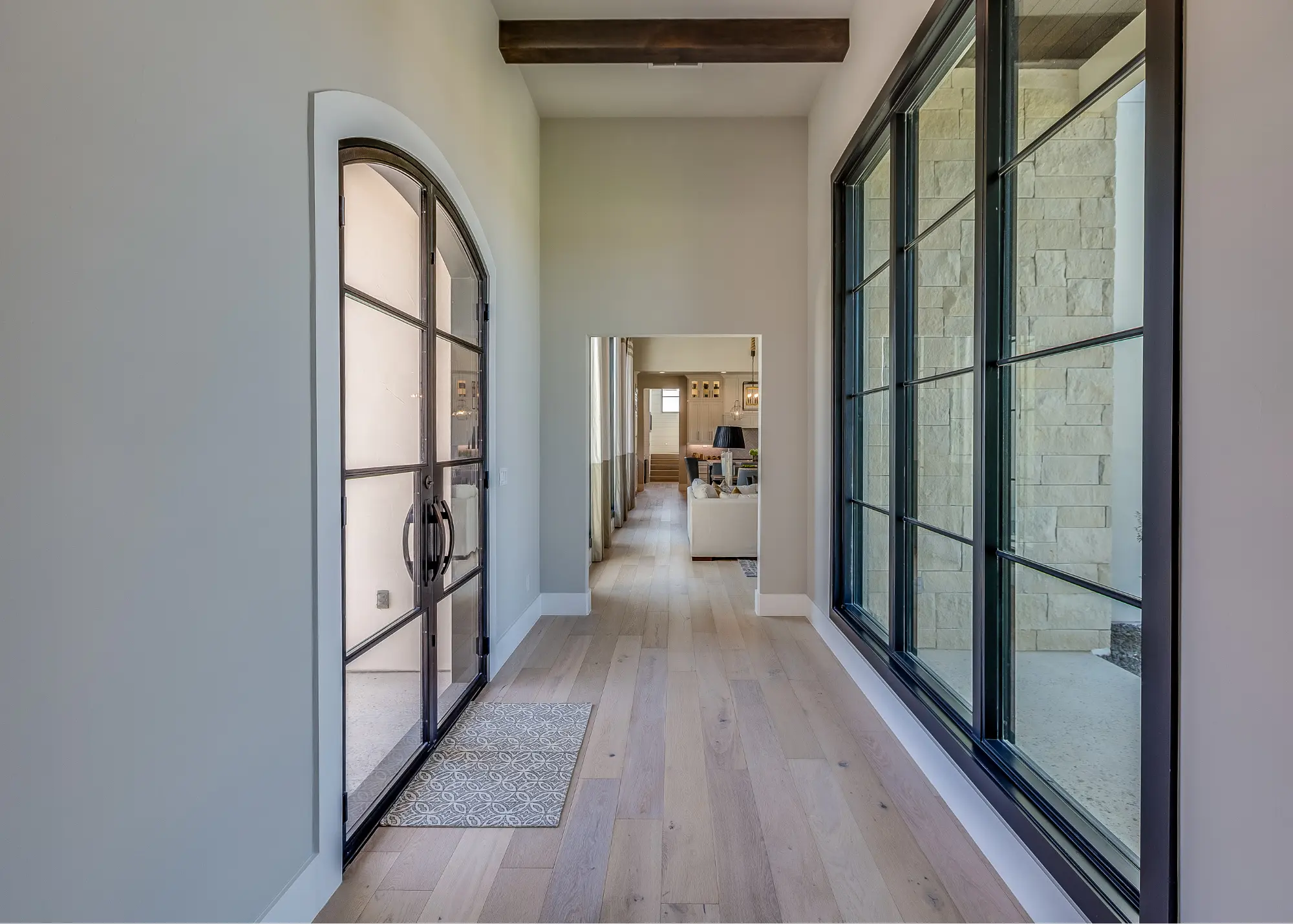 Tinted residential windows on a home illustrating window film for privacy and solar heat control